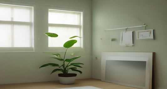 A bright, calm home office corner with a potted plant by the window and papers hung neatly on the wall.